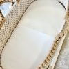 The little silk sheet placed in a crochet moses basket