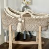 hooded crochet moses basket in cappuccino and vanilla on natural rocking stand