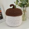 white and brown crochet acorn basket